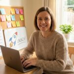 An enthusiastic beginner working at a laptop with motivational checklists, sticky notes, and a rocket icon symbolizing launching an online business for the first time.